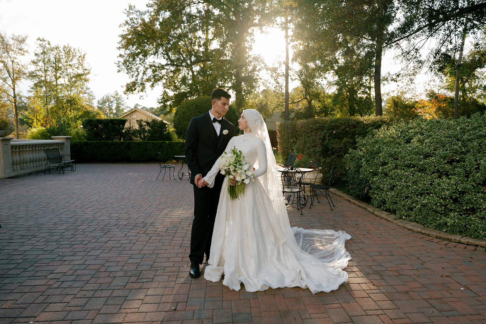 Bride and groom holding hands during an outdoor winter wedding at Cypress Springs Event Venue photographed by a Houston wedding photographer